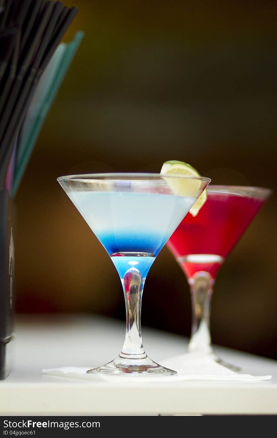 Cocktail on bar table - blue and red