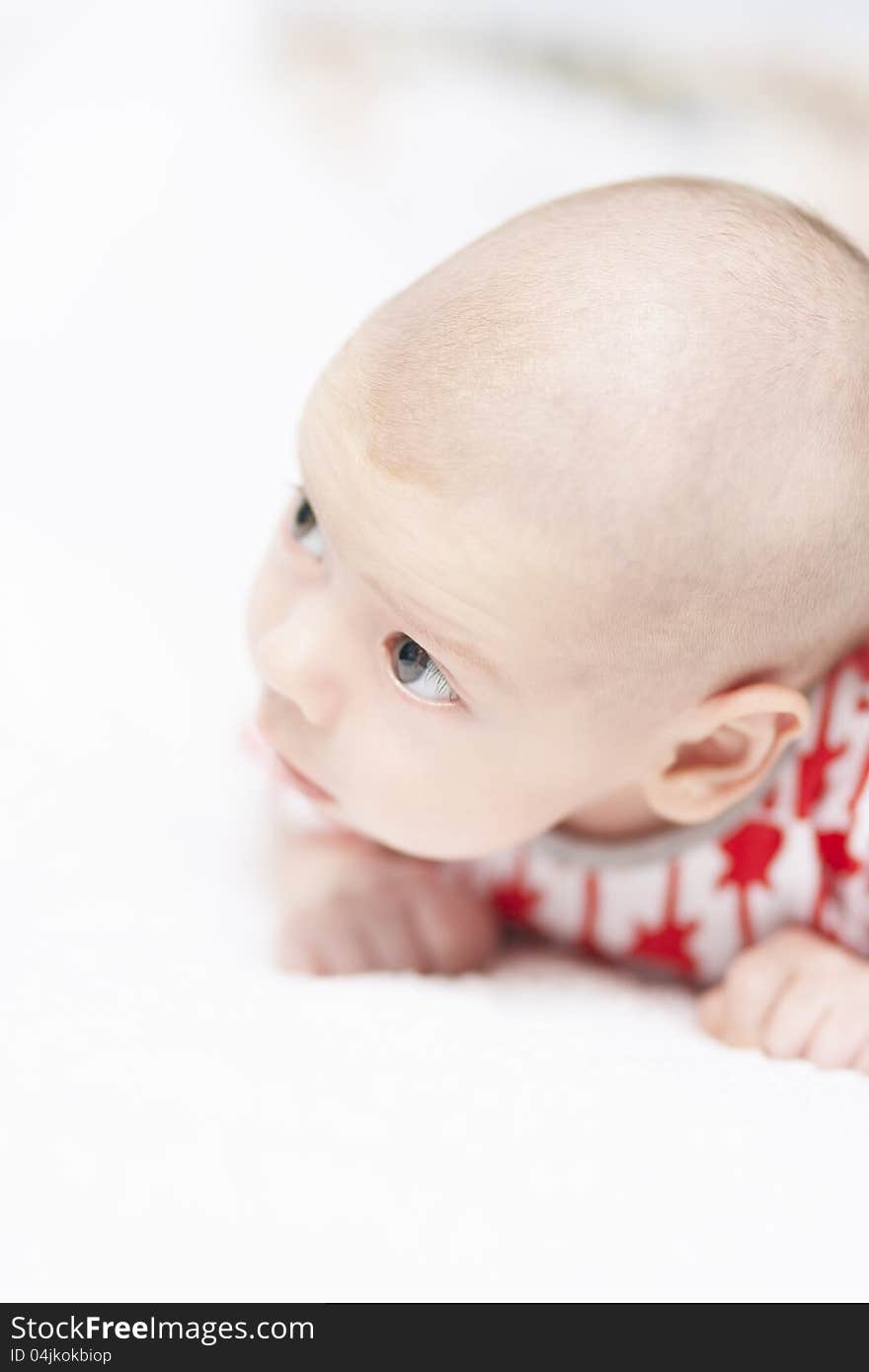 Lovely portrait of a little tiny newborn caucasian boy looking