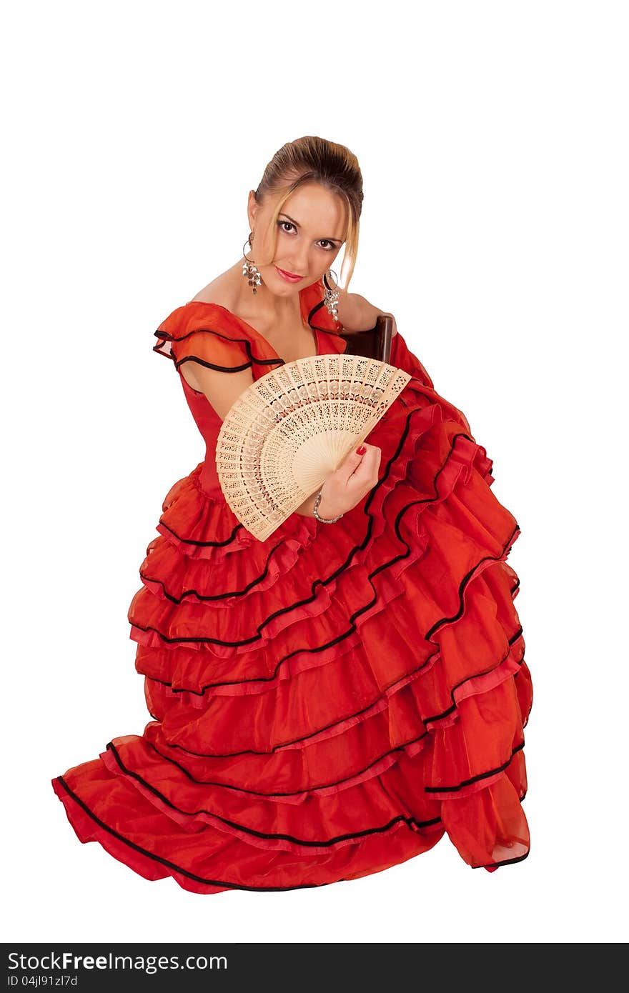 Young lady in red spanish dress holding a fan. Young lady in red spanish dress holding a fan