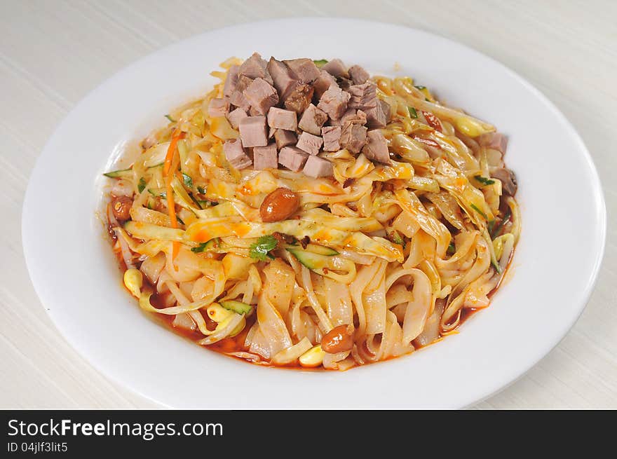 China Sichuan style noodles with pepper and minced meat. China Sichuan style noodles with pepper and minced meat