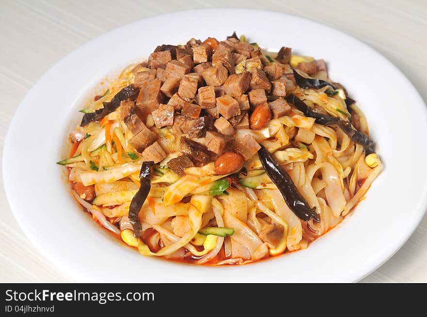 China Sichuan style noodles with pepper and minced meat. China Sichuan style noodles with pepper and minced meat