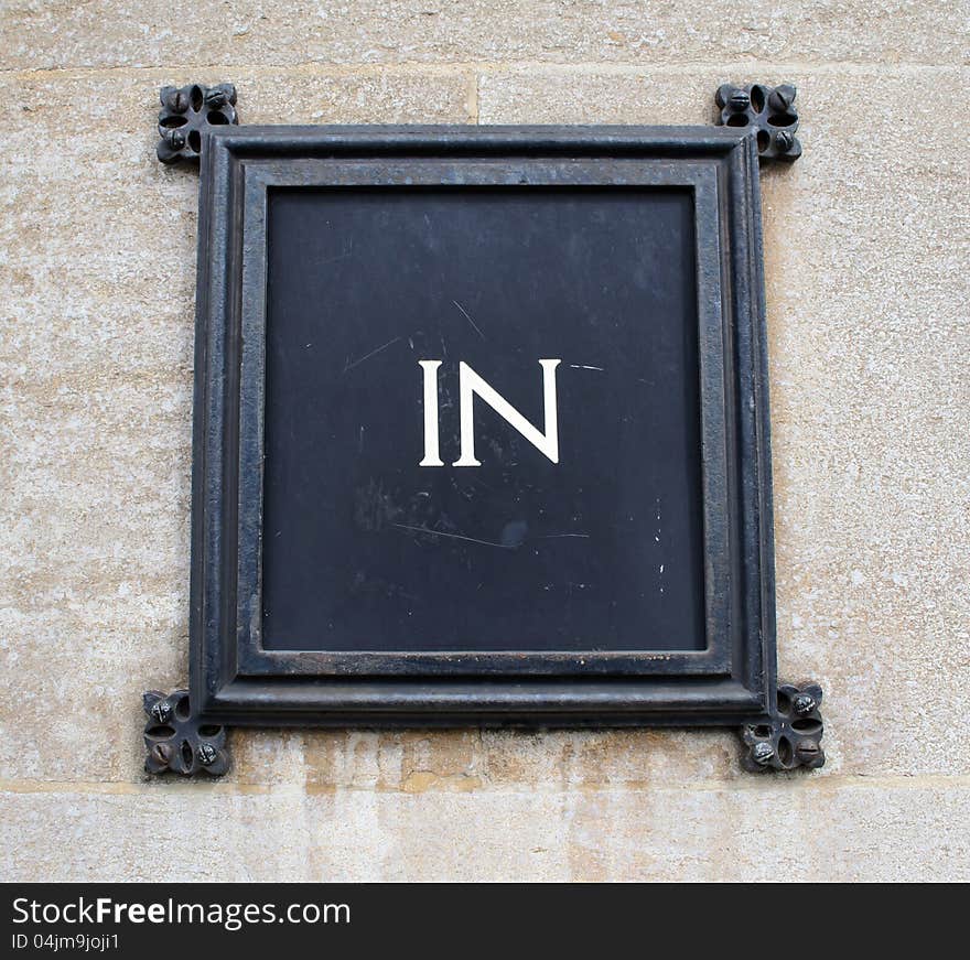 Sign indicating the entrance of a building. Sign indicating the entrance of a building