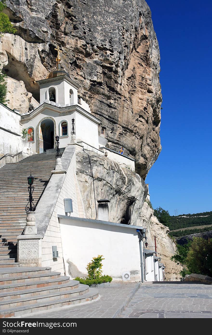 Nice white ortodox temple with long staircase on high mountain. Svyato-Uspensky Monastery in Crimea. Nice white ortodox temple with long staircase on high mountain. Svyato-Uspensky Monastery in Crimea