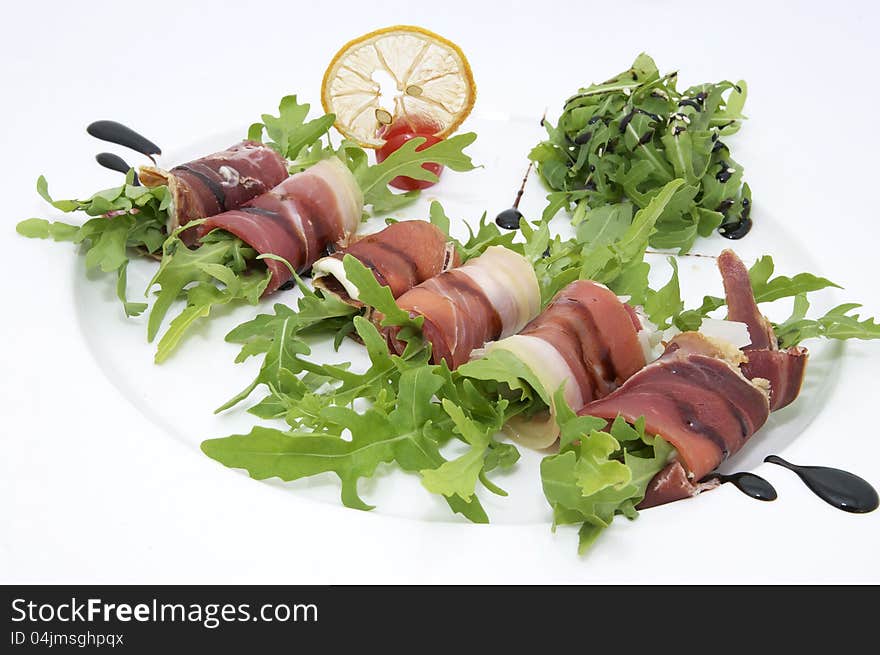 Rolls of meat and greens