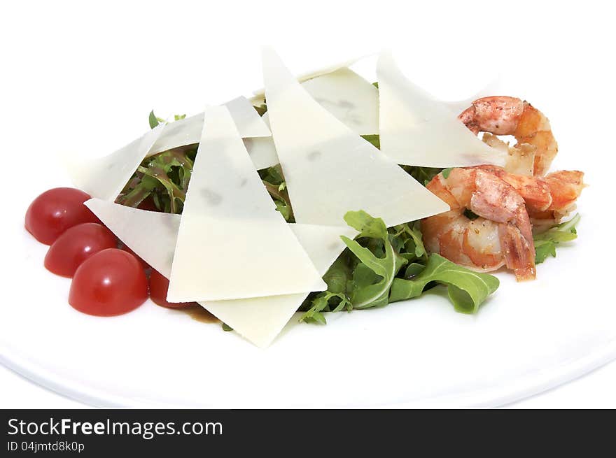 Shrimp salad and greens on a white background