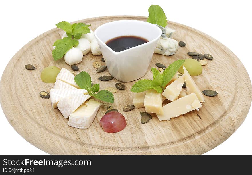 Cheese plate with a large decorated the assortment of mint