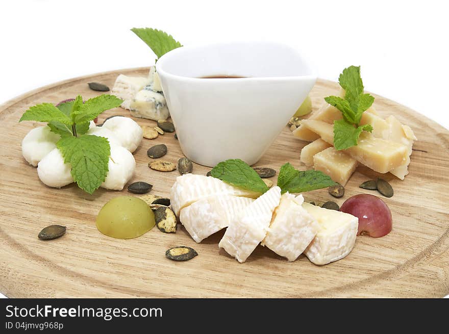 Cheese plate with a large decorated the assortment of mint