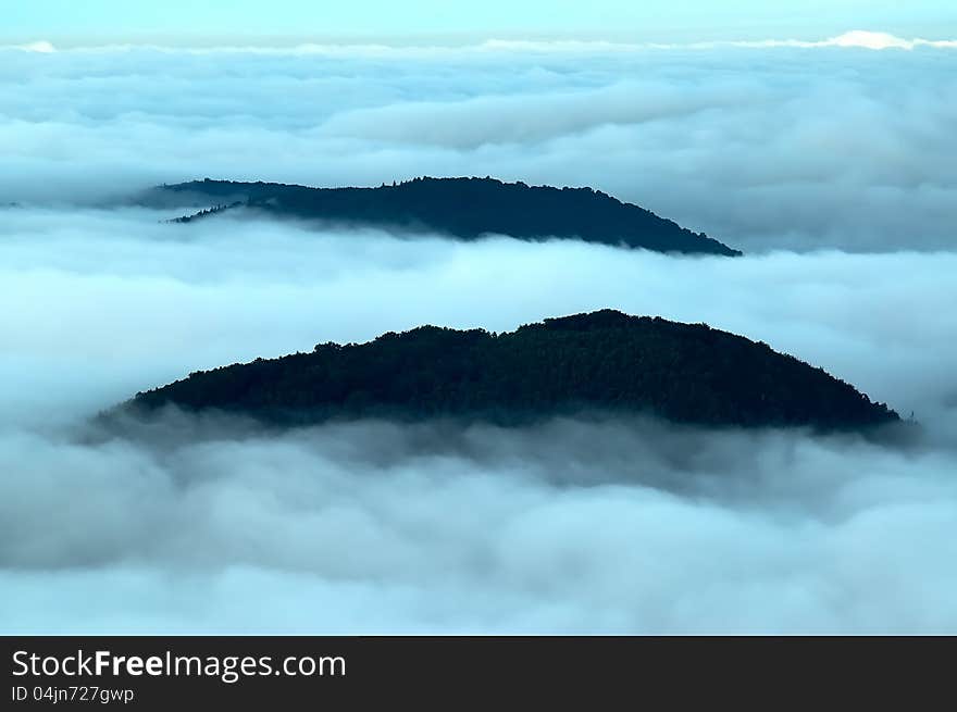 Morning inversions with wooded mountains. Morning inversions with wooded mountains