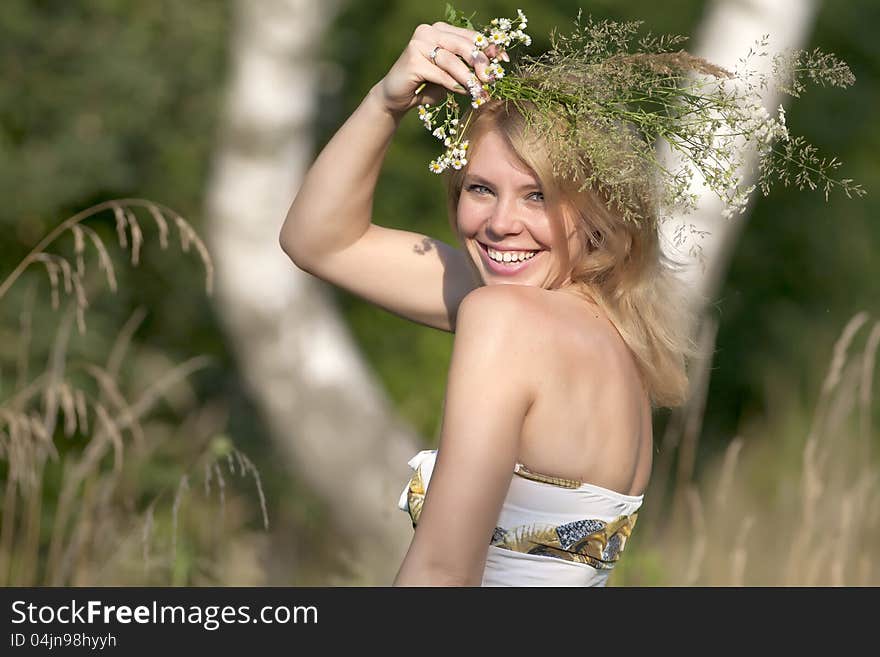 Happy girl with a flower on her head. Happy girl with a flower on her head