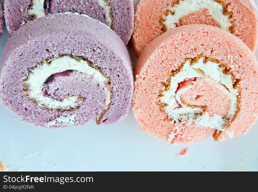 Many strawberry and taro swiss roll