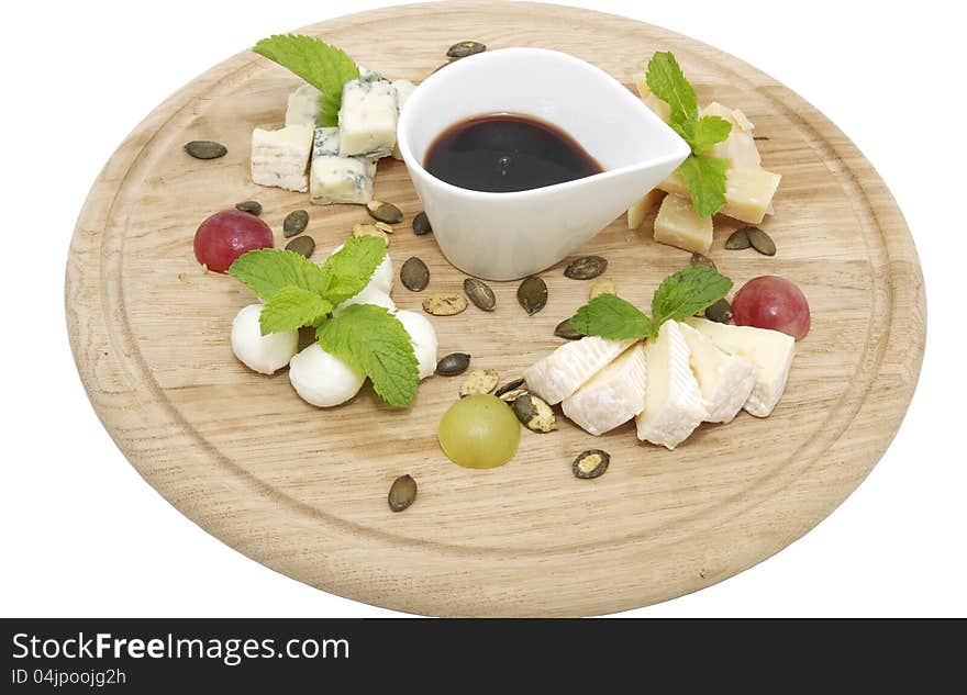 Cheese plate with a large decorated the assortment of mint