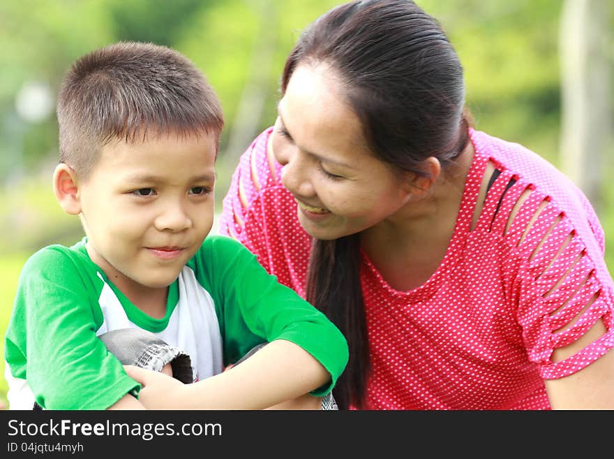 Mother and son relaxing in the park. Mother and son relaxing in the park