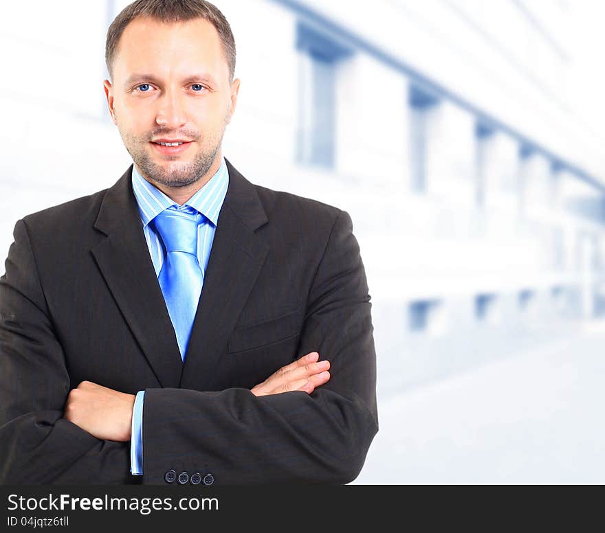 Portrait of handsome young businessman smiling