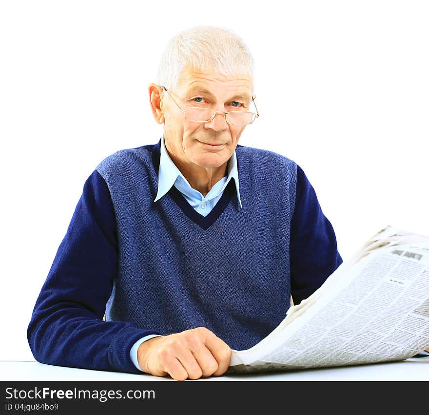 Portrait of an old man solving crosswords in the newspaper. Portrait of an old man solving crosswords in the newspaper