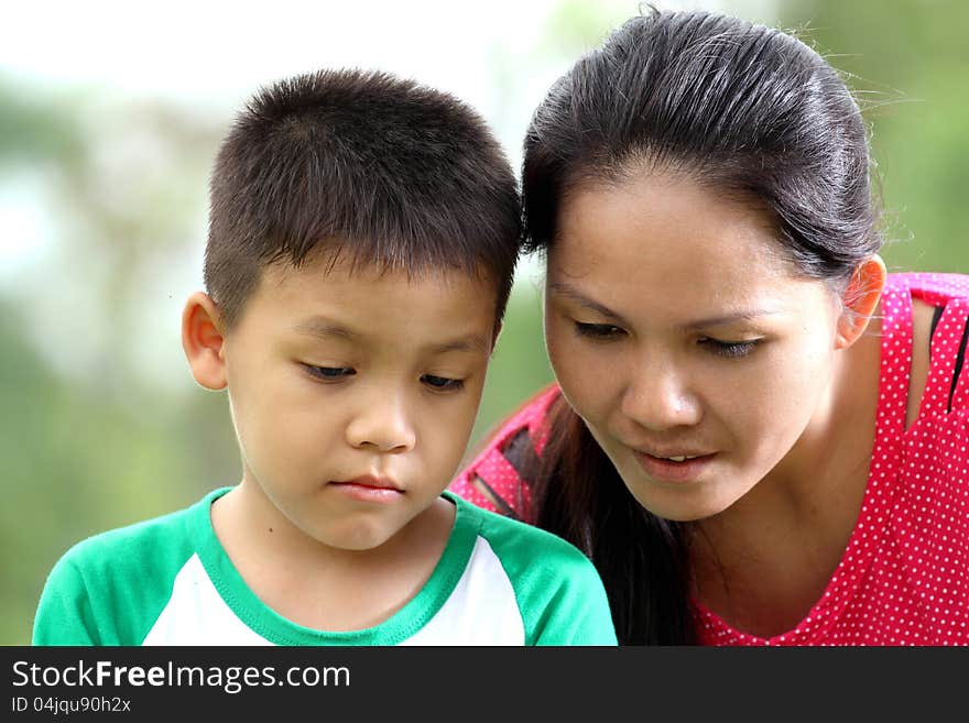 Mother and son relaxing in the park. Mother and son relaxing in the park