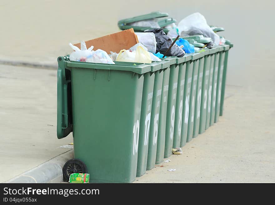 Row of large green bins, Garbage collection in the community