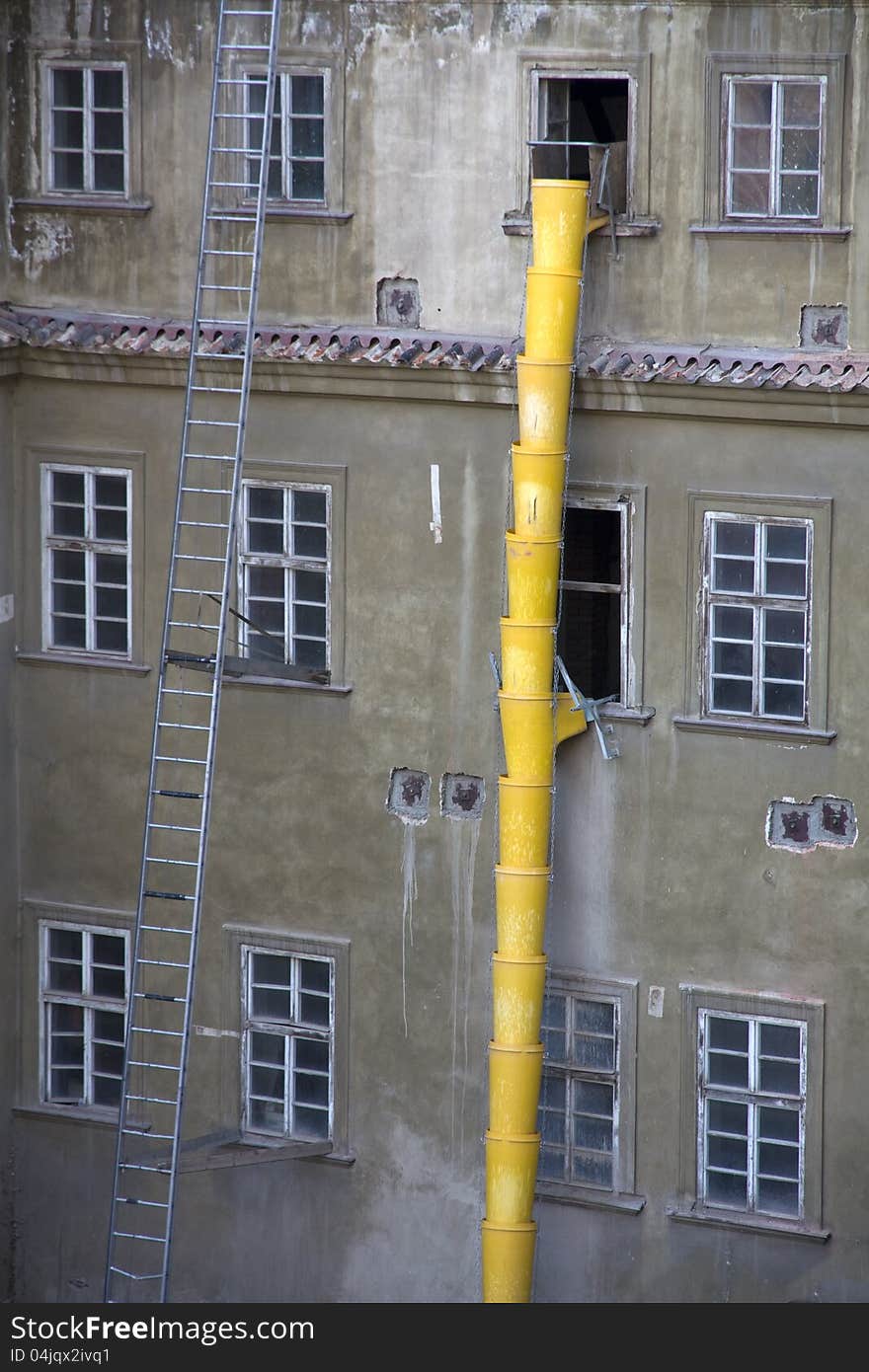 Yellow construction waste chute