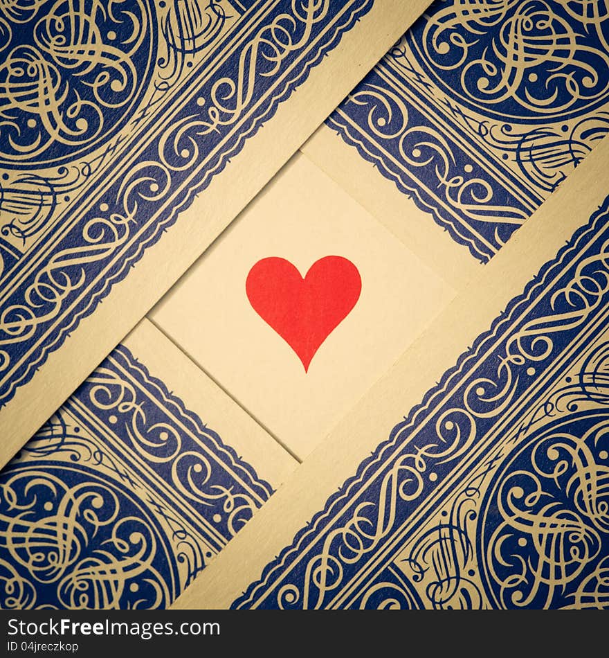 Arrangement of playing cards showing the backside with hearts on the free space