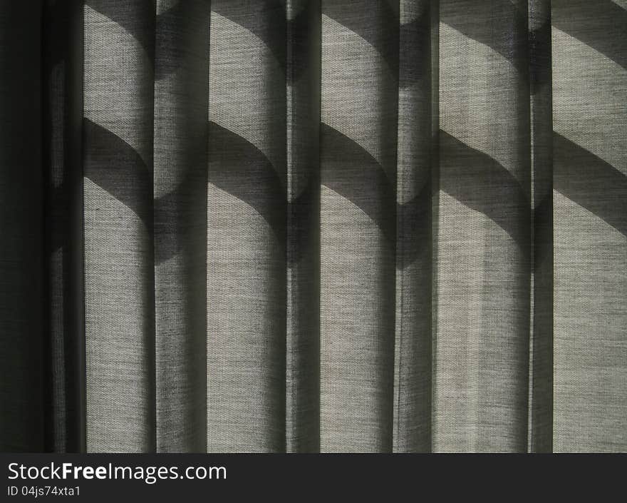 Shade on Grey Curtain, Sunlight Through a Window