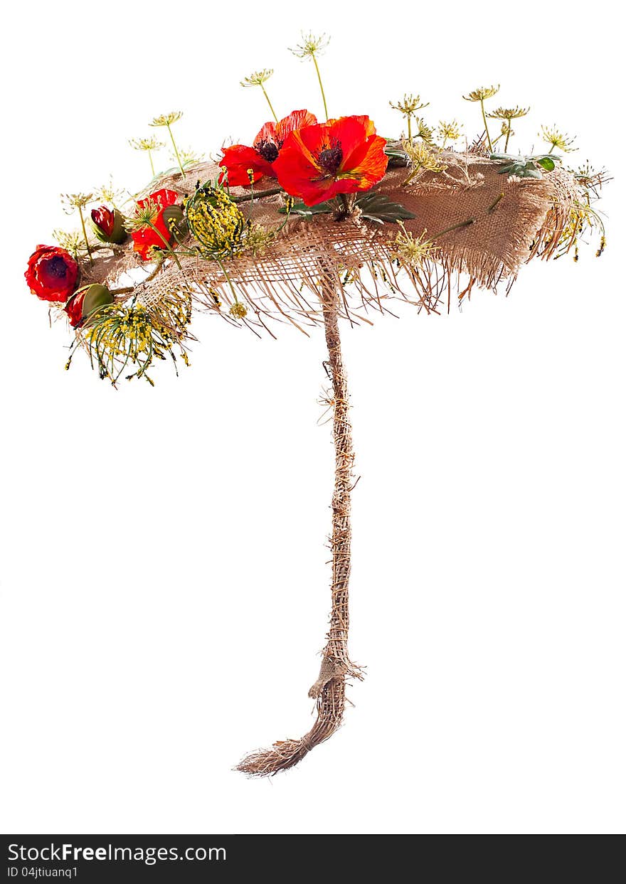 Umbrella of burlap and artificial flowers poppy