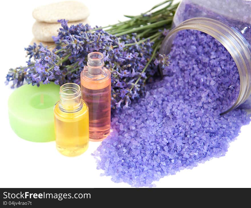 Lavender bath salt, cosmetics and fresh lavender on a white background. Lavender bath salt, cosmetics and fresh lavender on a white background