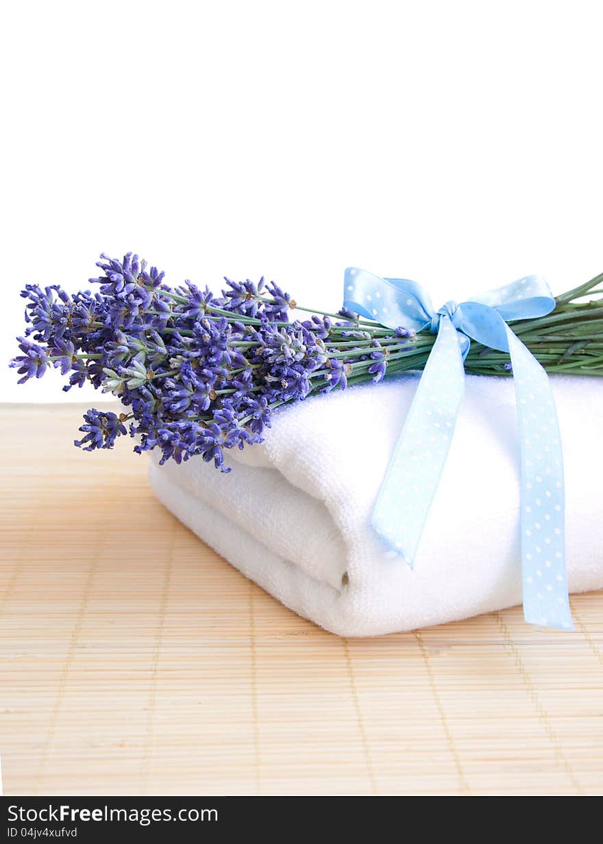 Lavender bunch with blue ribbon  and white towel. Lavender bunch with blue ribbon  and white towel