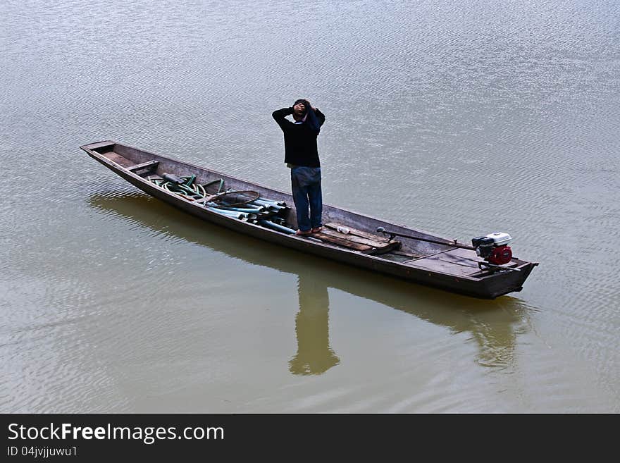 Thai fishermen were fishing in a boat. Thai fishermen were fishing in a boat