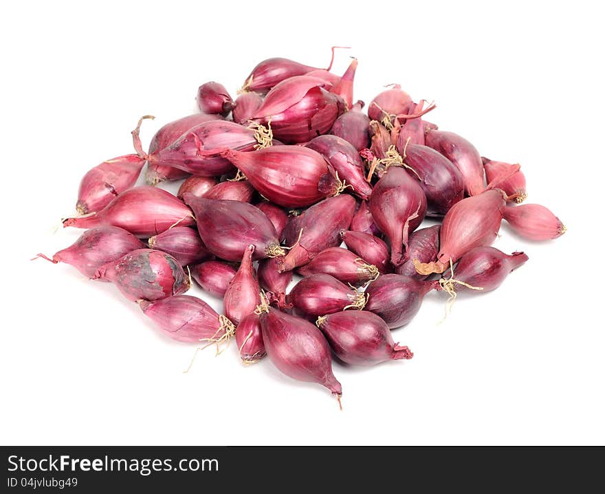 A pile of red onion set on a white background