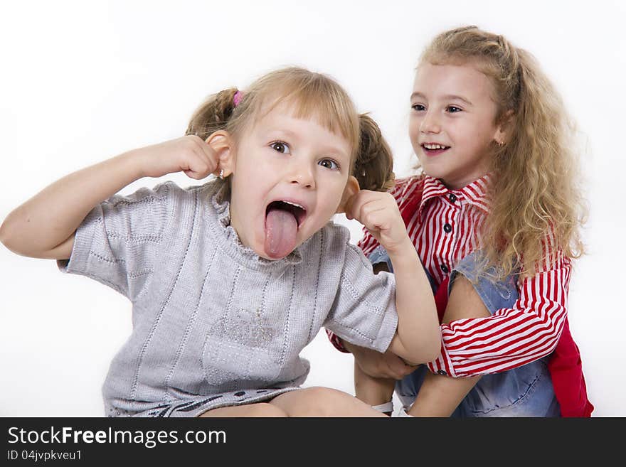 Two fun girls of the girlfriend play. White isolated. Two fun girls of the girlfriend play. White isolated.