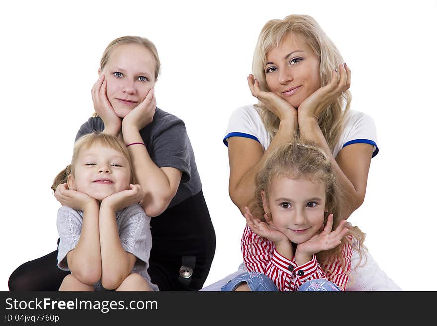 Two mothers and two daughters - cheerful girlfriends. Iisolated on white. Two mothers and two daughters - cheerful girlfriends. Iisolated on white.