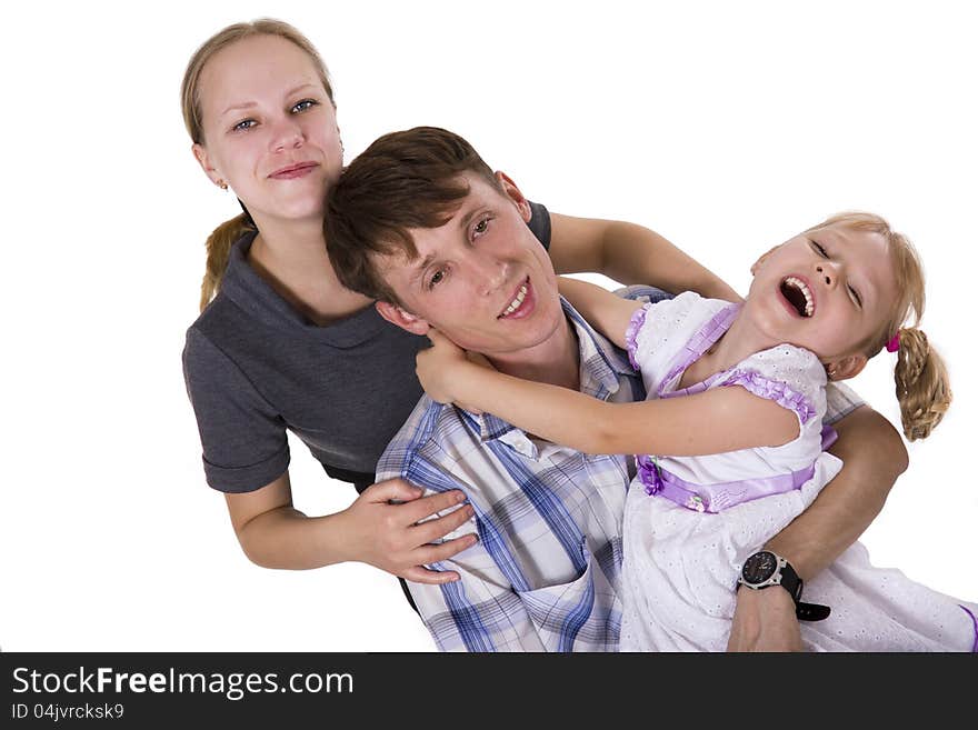 Young European family from three persons - mother, father and daughter. Isolated. Young European family from three persons - mother, father and daughter. Isolated