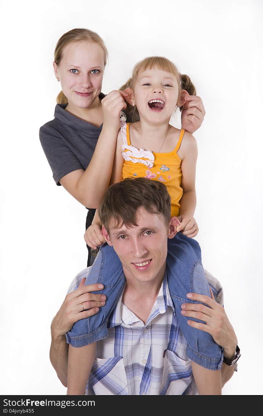 Young European family from three persons - mother, father and daughter. Isolated. Young European family from three persons - mother, father and daughter. Isolated