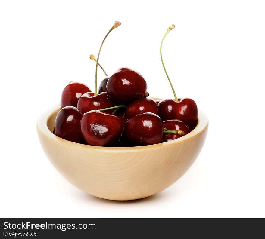 Perfect Sweet Cherry in wooden bowl isolated on white background