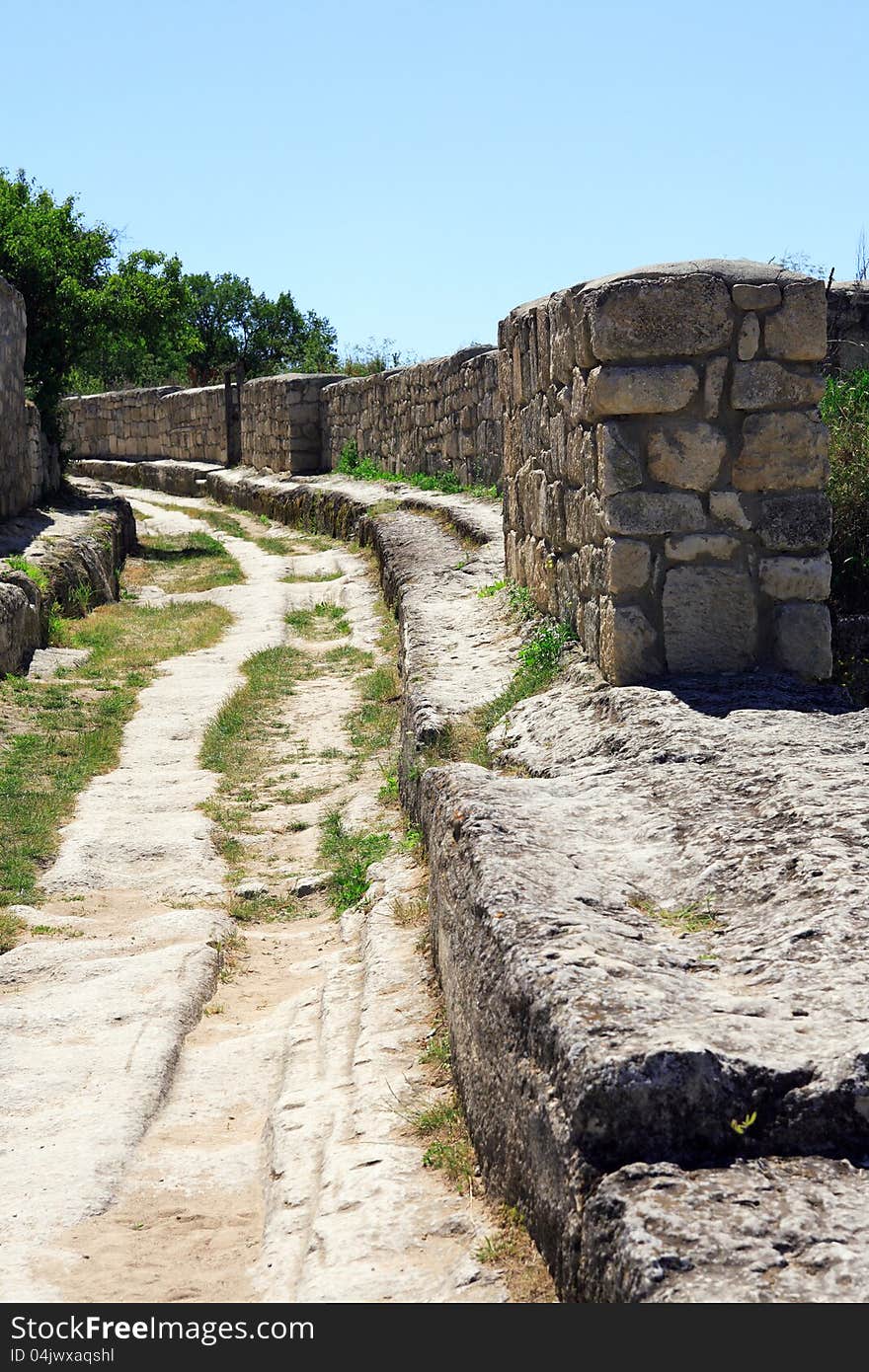 Closeup of road and stone wall in ancient Karaite town, Crimea. Closeup of road and stone wall in ancient Karaite town, Crimea