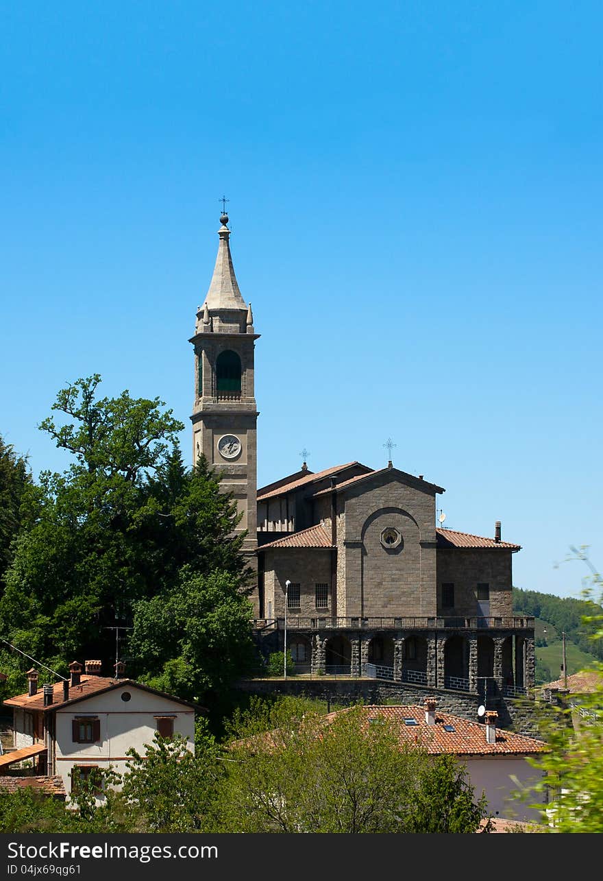 Small church with steeple in italian village