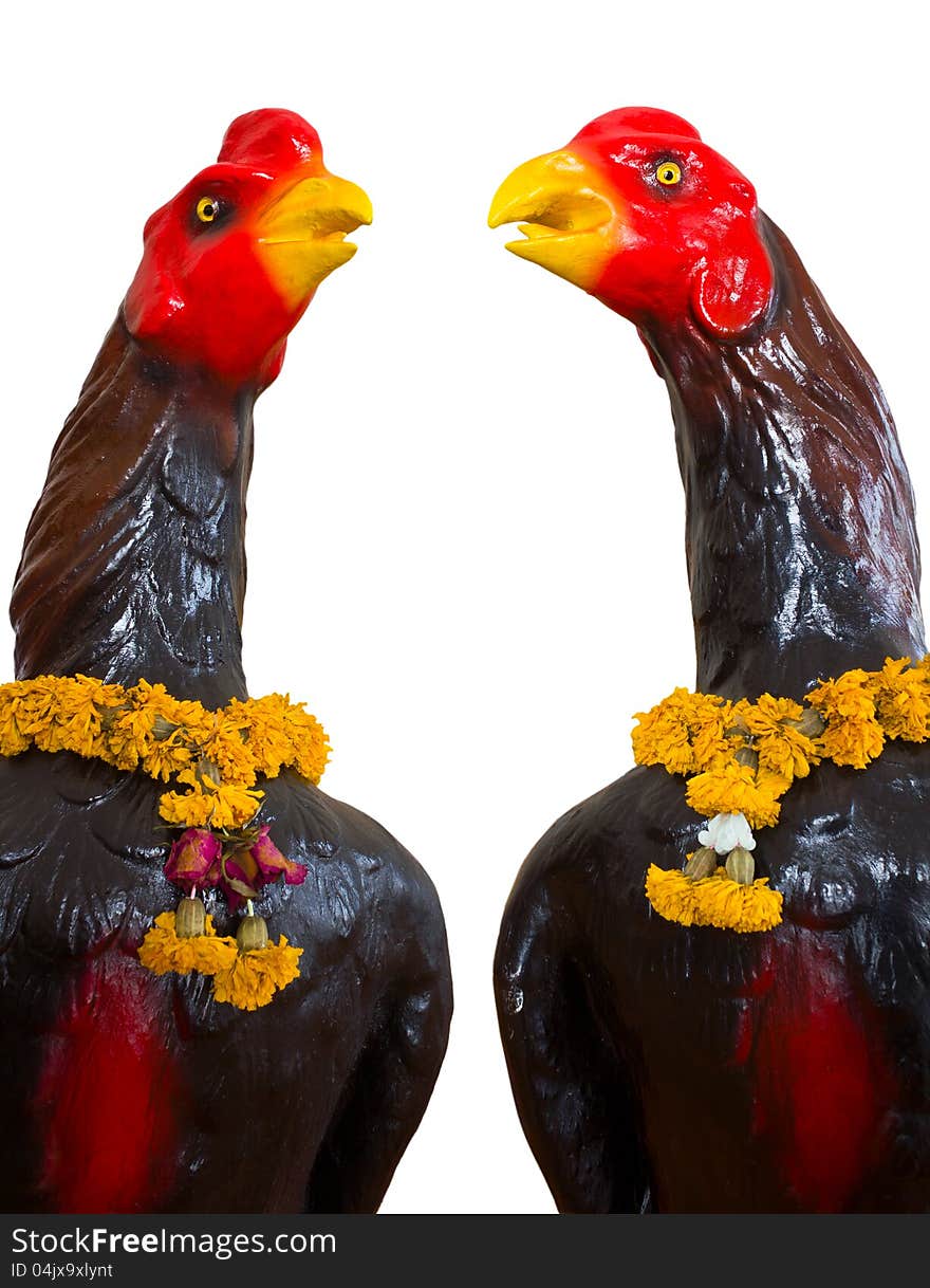 Isolates of the statue, which has two black chickens garland of flowers that are withered neck. Isolates of the statue, which has two black chickens garland of flowers that are withered neck.