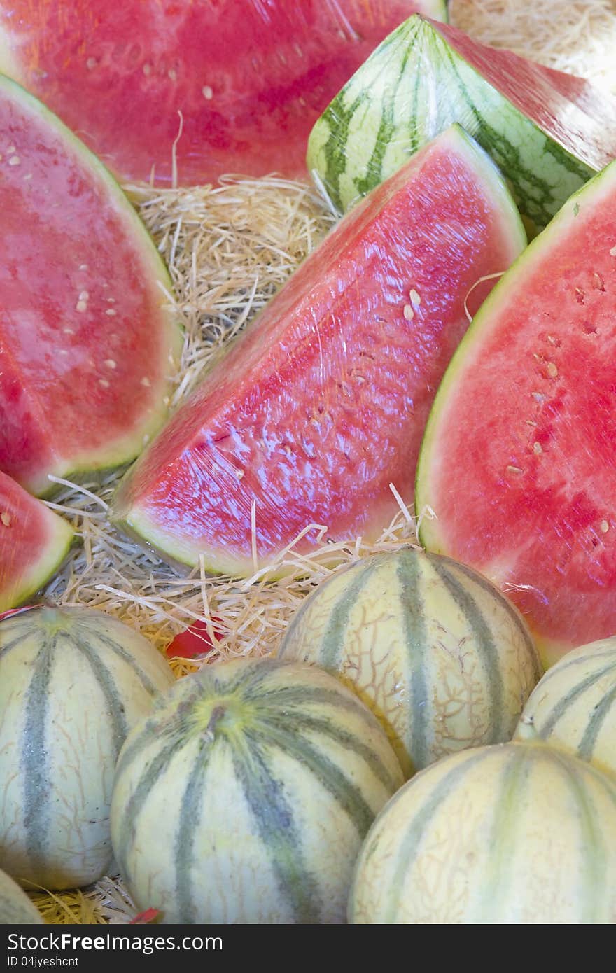 Melons ready for sale on the market. Horizontally.