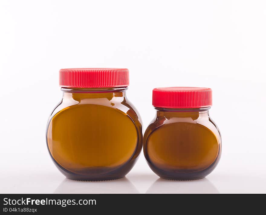 Empty glass bottles on white background