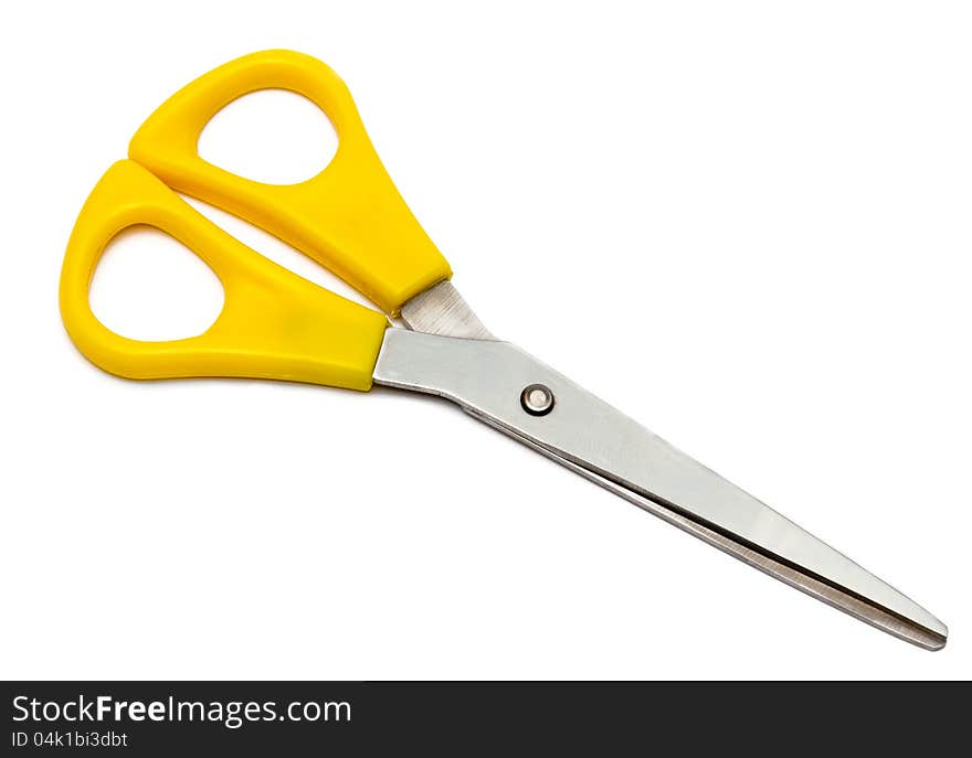 A yellow scissor isolated in white background. A yellow scissor isolated in white background