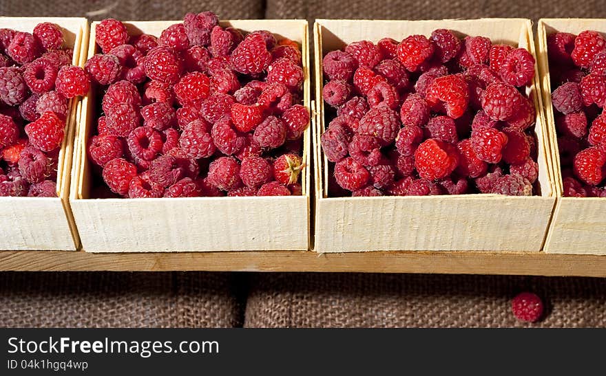 Small Containers Of Raspberries Ready For Sale