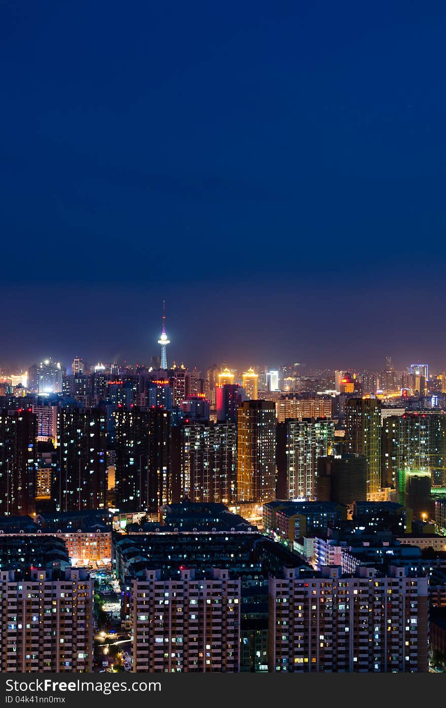 This image was taken from the top of an apartment and show Harbin, China illuminated at night. This image was taken from the top of an apartment and show Harbin, China illuminated at night.