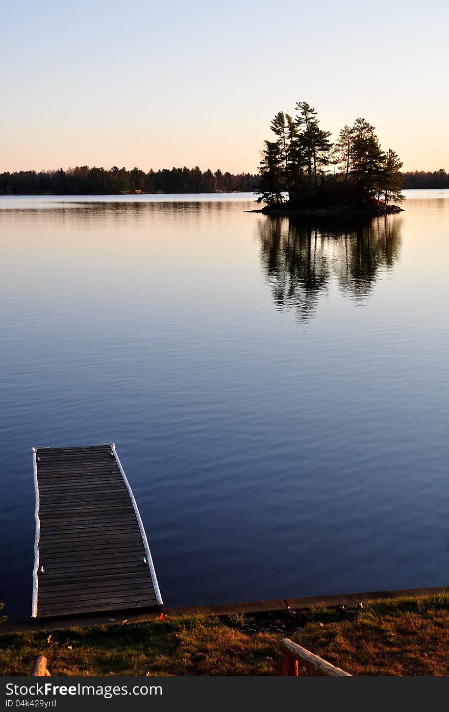 Pier and island at sunset