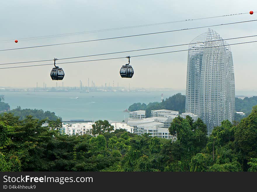 Cable Cars Passing By Skyscraper