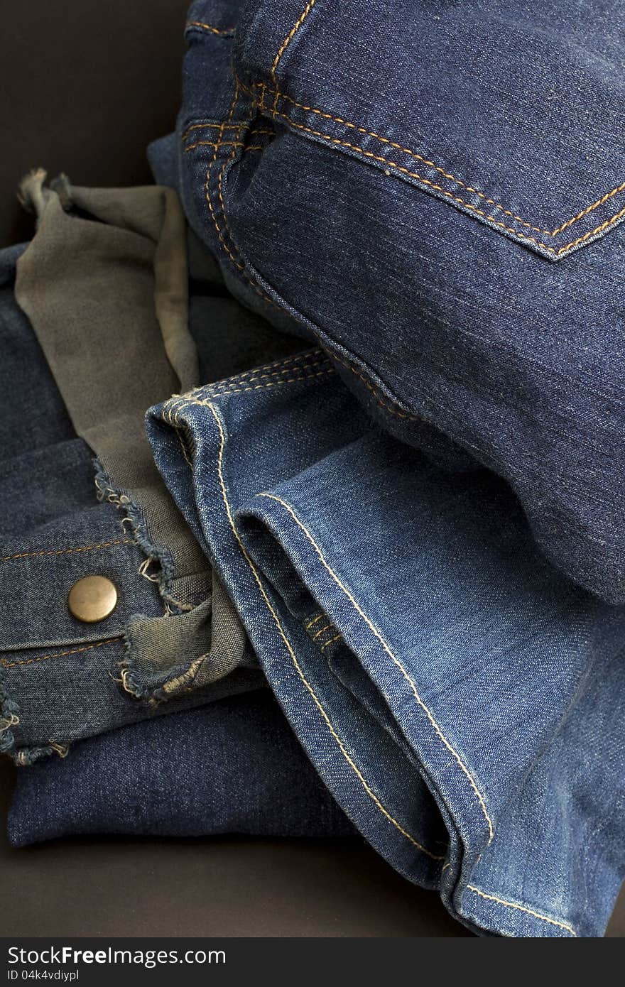 Close-up of a messy pile of jeans. Close-up of a messy pile of jeans.