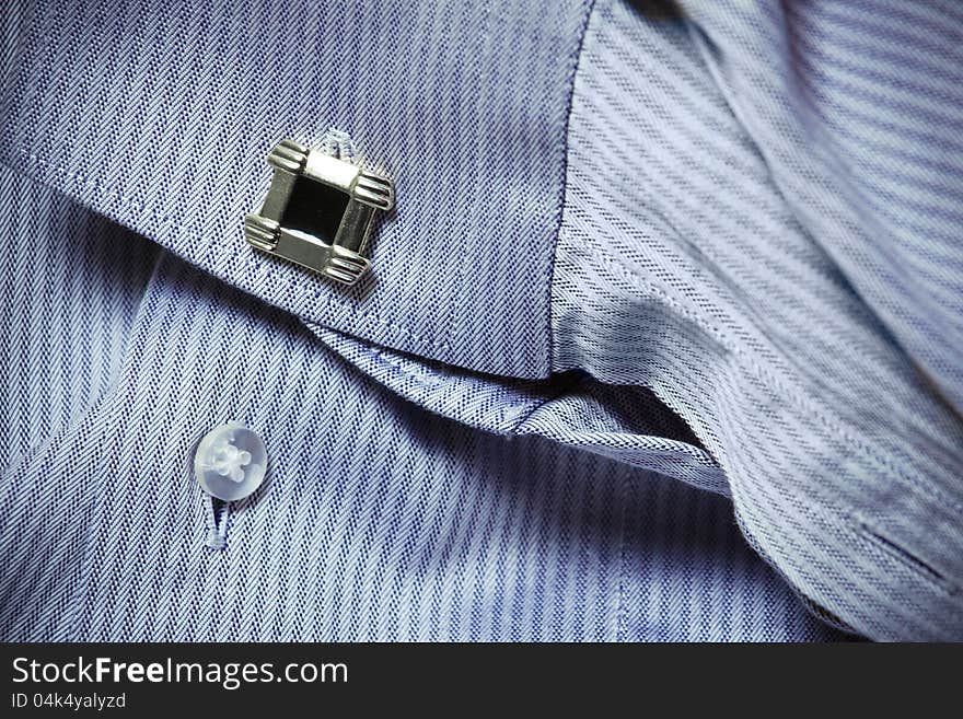 Shirt-sleeve with cuff link close-up. Shirt-sleeve with cuff link close-up