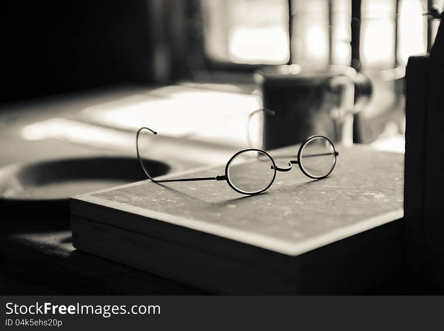 Old glasses on a pioneer-era desk. Old glasses on a pioneer-era desk.