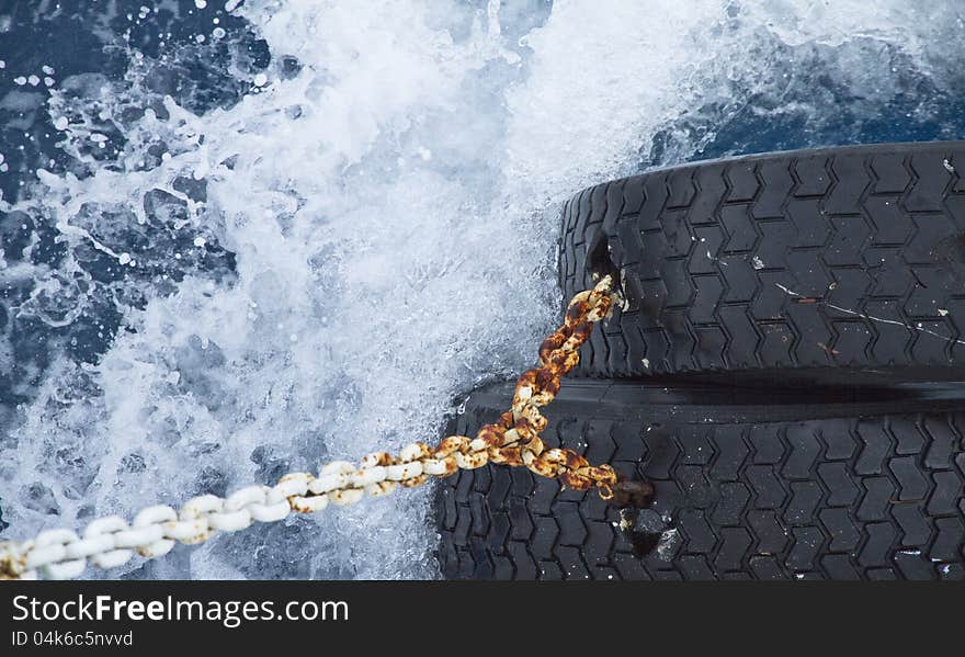 Water surface with splashing waves and boat equipment