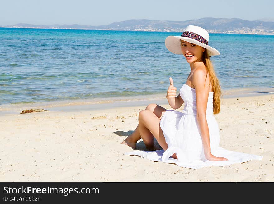 Happy Young Beautiful Woman  On The Beach