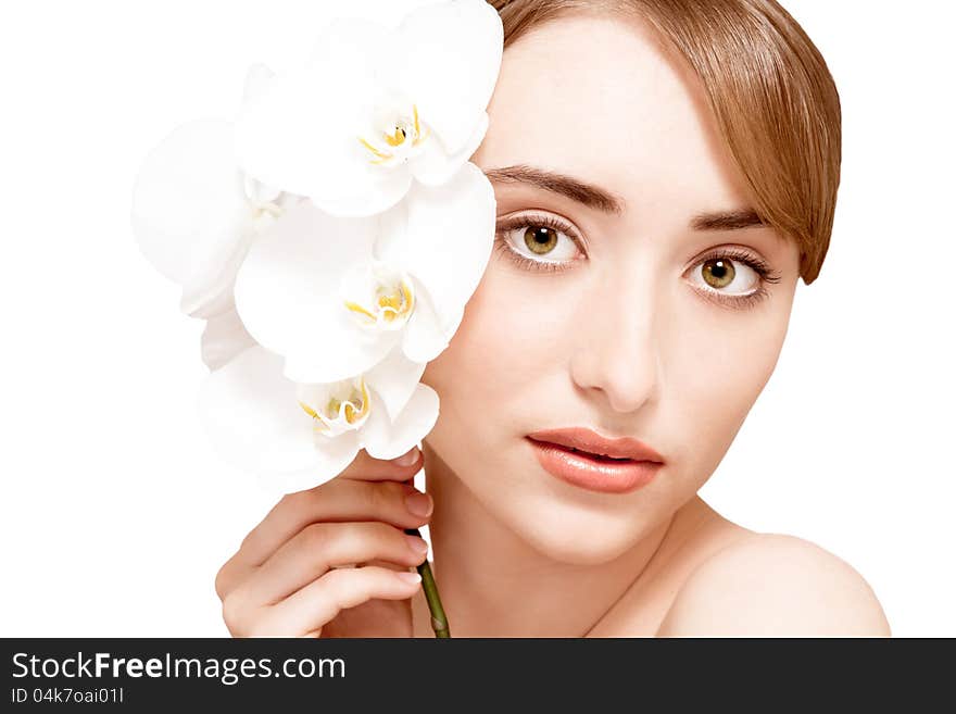 Face of the young woman with flower