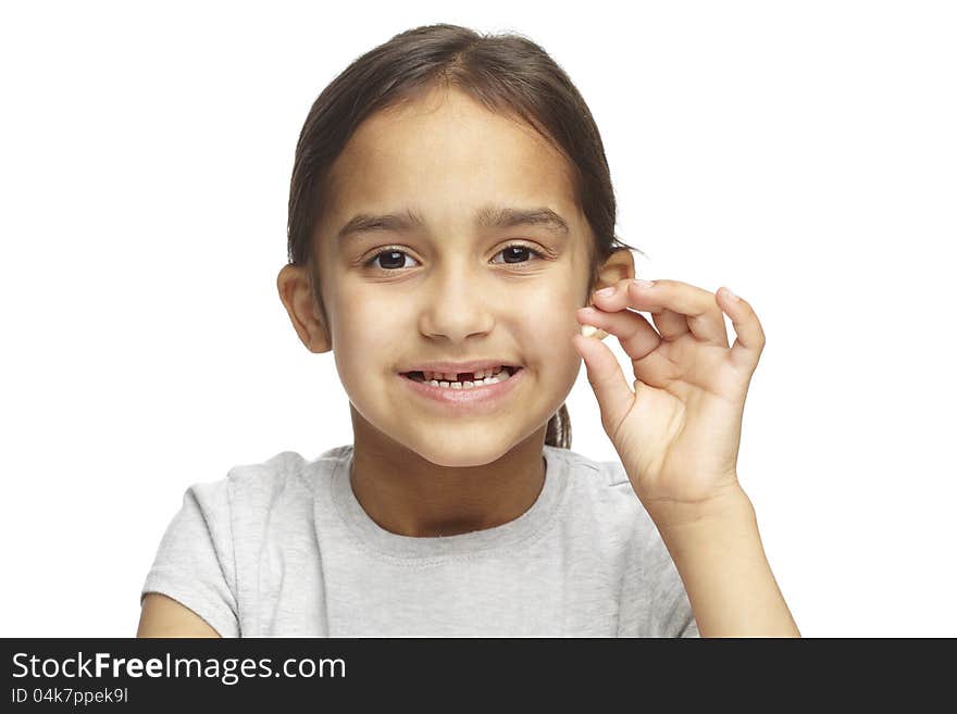 Young girl with missing front tooth on white background